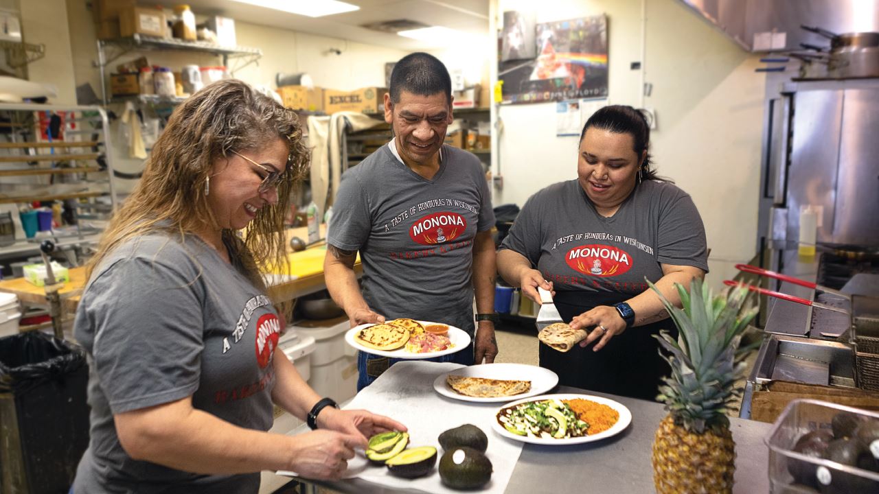 Three members of the family that owns Monona Bakery cook together in the restaurant's kitchen.