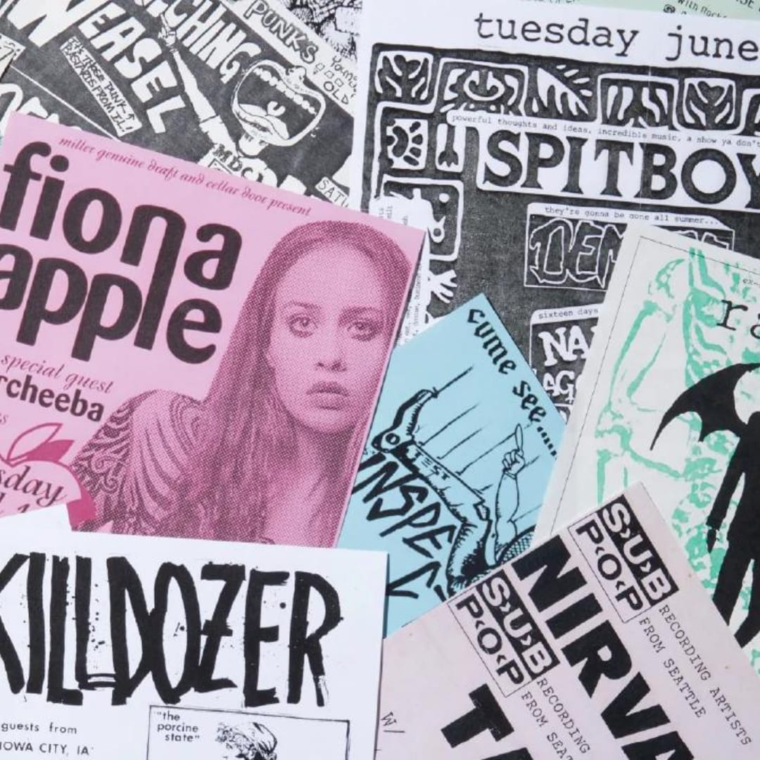 A collage of old tour posters including Fiona Apple and Spitboy. 