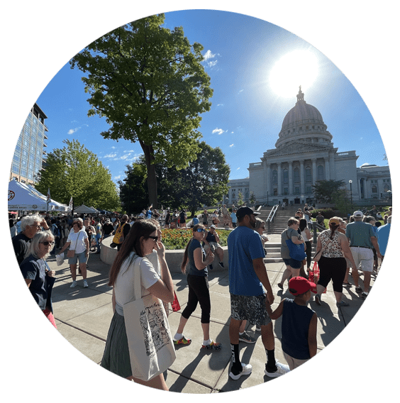 people walking in front of the Capitol building