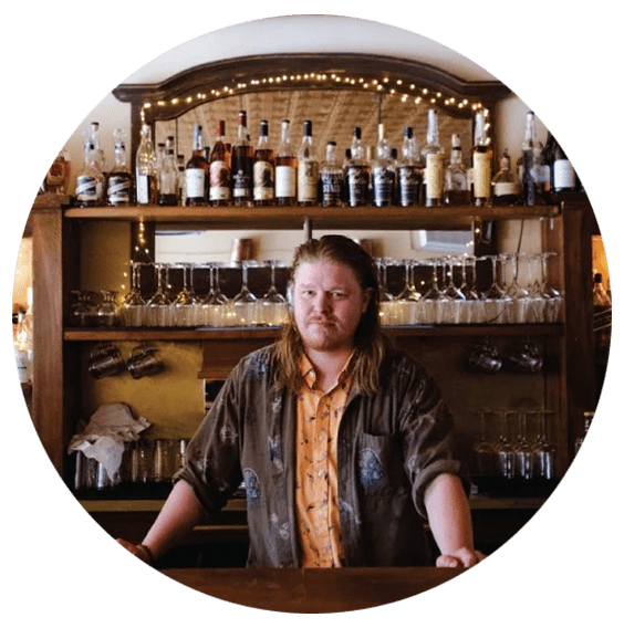 owner of Hone at the bar of the restaurant