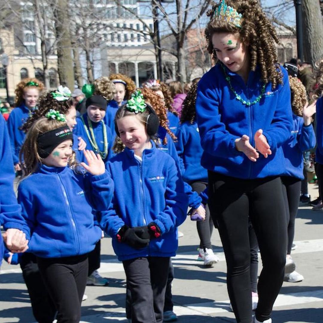 Irish dancers in blue fleeces at the St. Patrick's Day parade