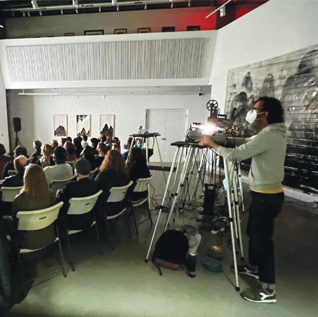 Room of people watching a movie at Mills Folly Microcinema