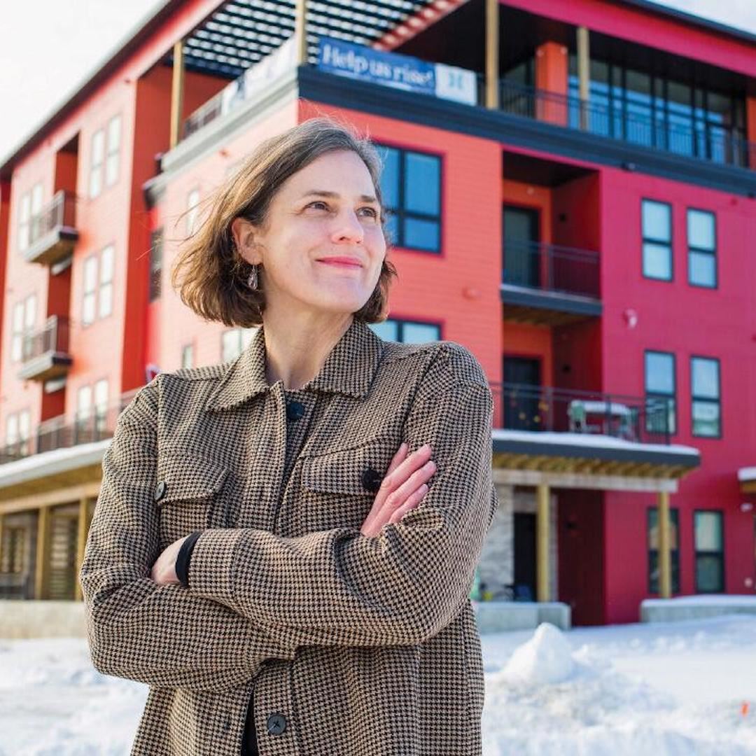 Alexis London standing in front of the Bayview Foundation's new development