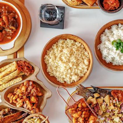 An overhead view of a spread of dishes at Les Delices de Awa.