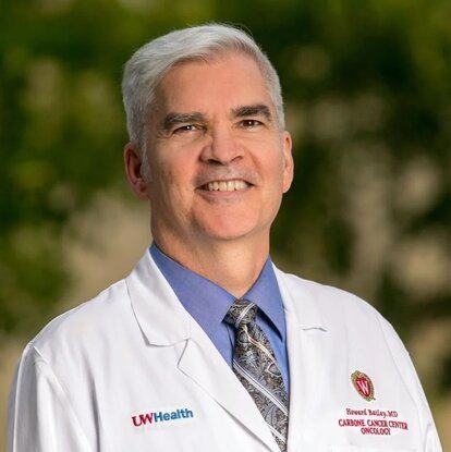 Photo of Howard Bailey smiling while wearing a white jacket with a UWHealth logo.