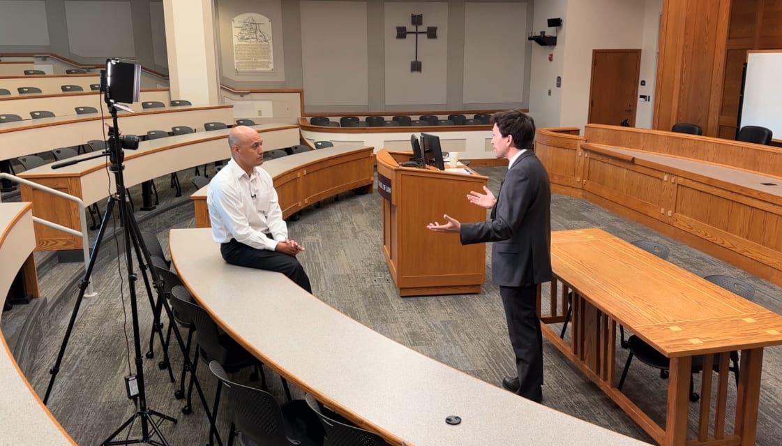 Picture of 4 News Now anchor Derek Deis interviewing a law school professor at Gonaga university