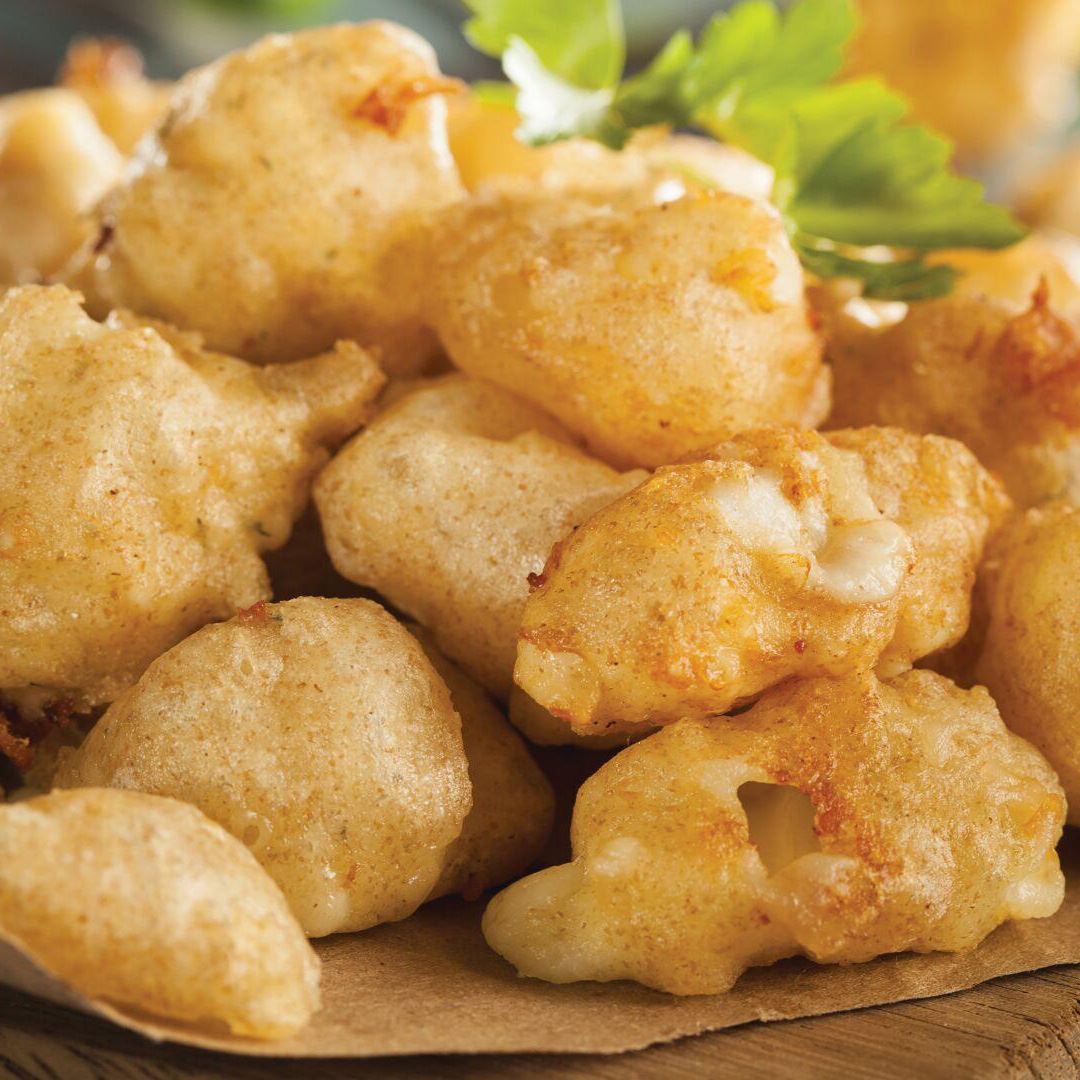 A close-up shot of fried cheese curds.