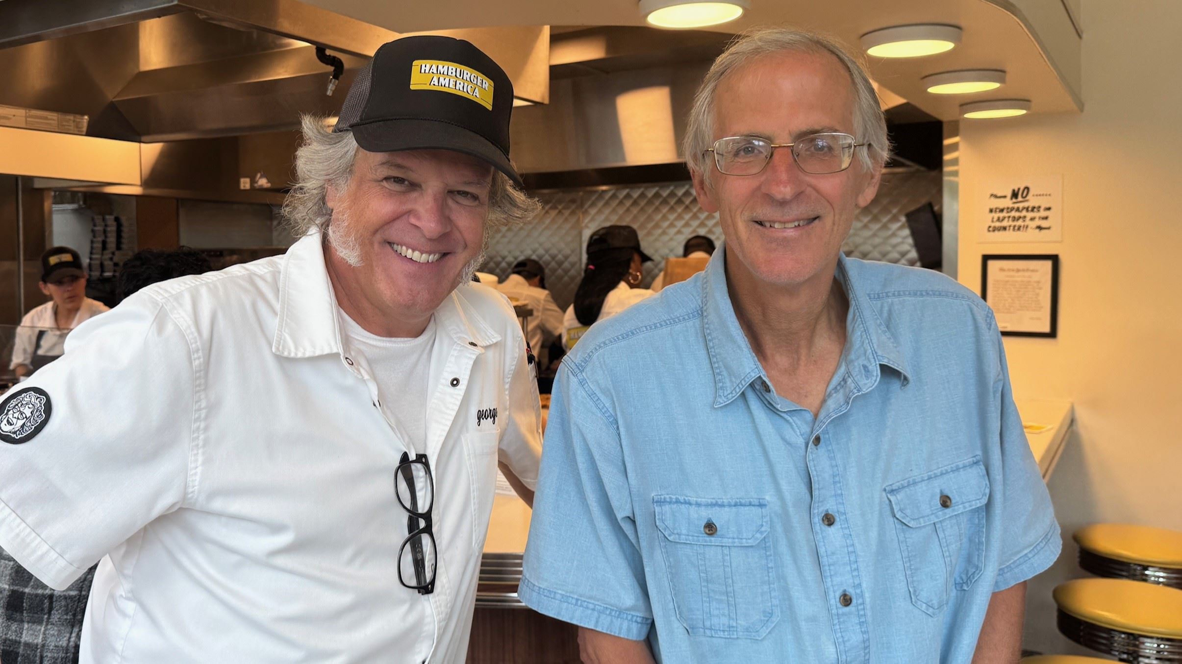 George Motz (left) and Doug Moe (right) in Motz's restaurant, Hamburger America.